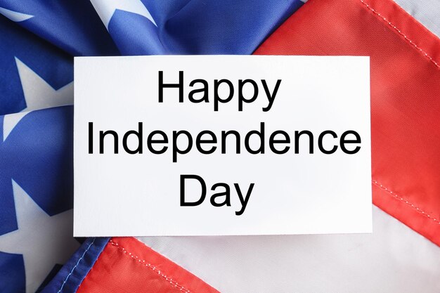 Greeting card and colorful USA flag top view Happy Independence Day