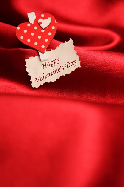 Greeting card for Valentine39s Day on a red silk