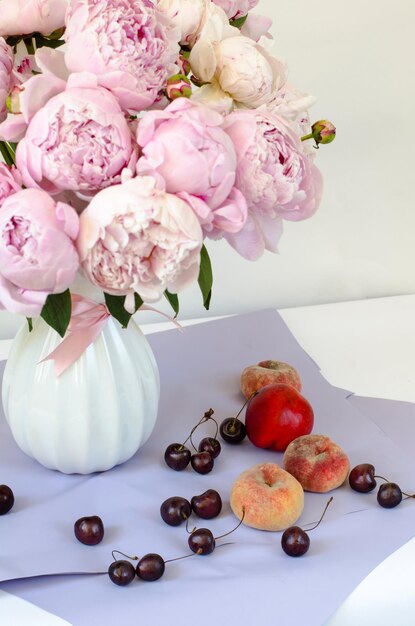 Greeting card with a bouquet of pinks beautiful huge peonies