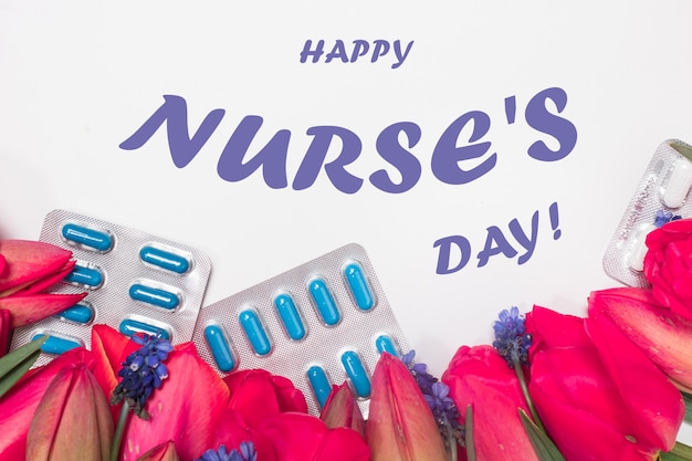 Photo greeting card with flowers and pills with inscription happy nurse's day