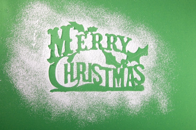 Greeting card with a Merry Christmas tree and snow, a symbol of the holiday