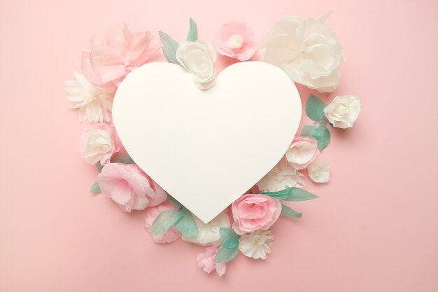 greeting card with paper flowers on rose 