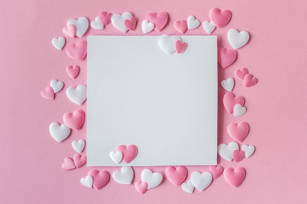 Greeting card with pink and white hearts