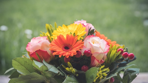 Greetings anniversary or Mother's Day concept Close up of colorful fresh spring flower bouquet with gerbera and pink roses