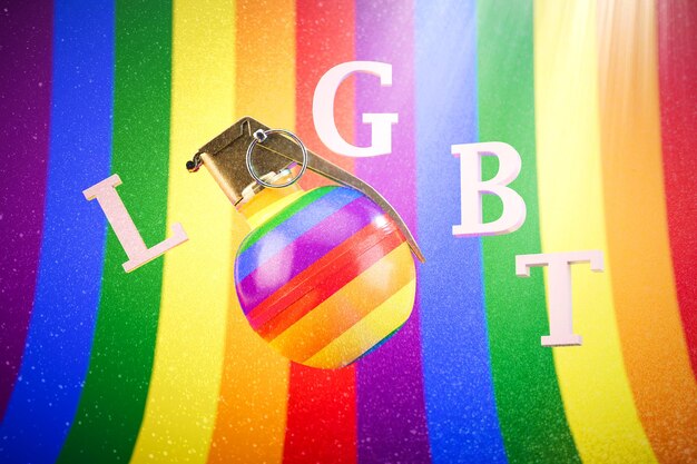 Photo grenade and lgbt inscription on a multicolored background of the lgbt community 3d render