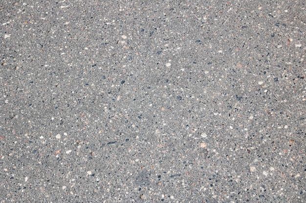 Grey asphalt on the road close up