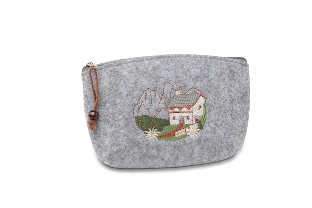 A grey bag with a picture of a house on the front.