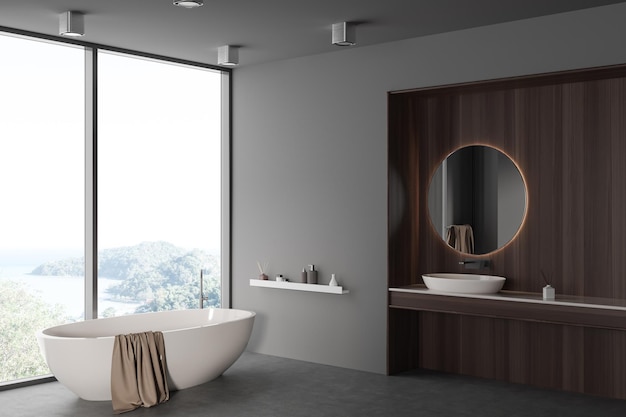 Grey bathroom interior with sink and mirror tub near panoramic window Mockup