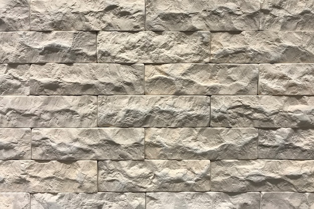 Grey brick wall texture background. Tiled with cope space