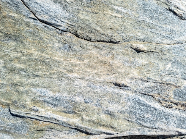 Grey brown stone wall background texture Rocky formation Greek island Cyclades Greece