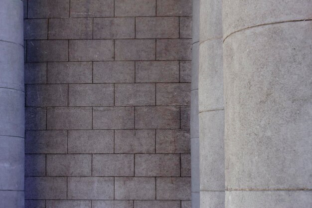 Grey building wall with columns as a city background