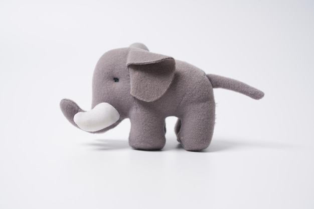 Photo grey colored toy elephant on a white background