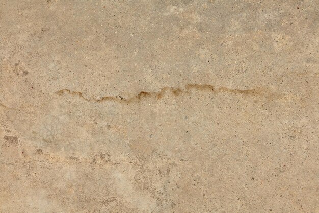 Grey concrete material with a crack