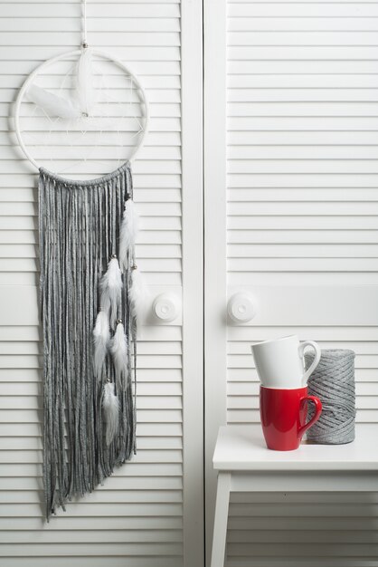 Grey dream catcher with white feathers