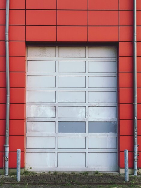 Photo grey garage door comprised by red