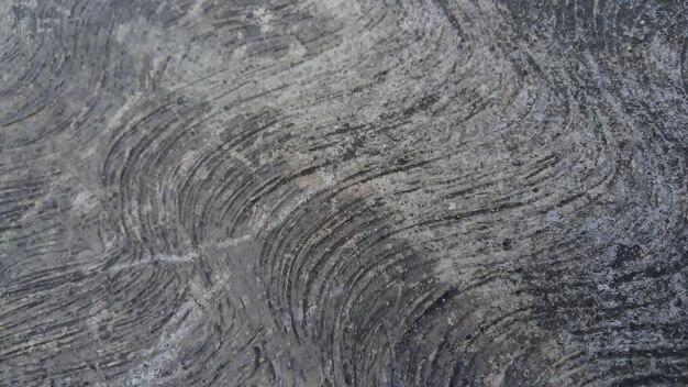 粗い質感を持つ灰色の花崗岩の表面