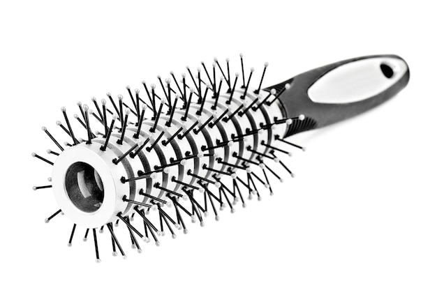 Photo grey hairbrush on white background