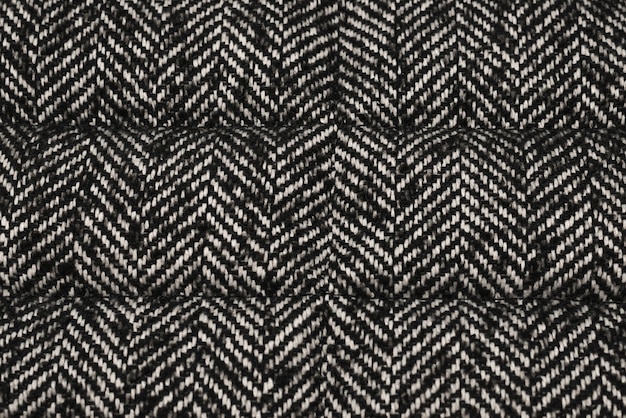 Grey knitted fabric texture. top view.