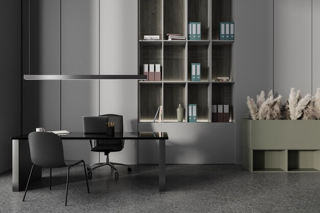 Grey office interior with desk and laptop chairs and shelves with documents