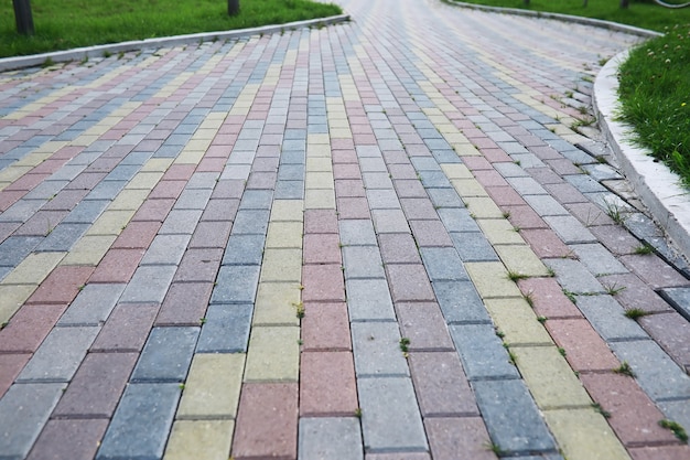 Grey paving stone, pedestrian walkway, pavement close up, the texture, top view.Cement brick squared stone floor background. Concrete paving slabs. Paving slabs