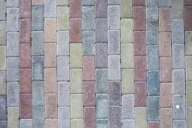 Grey paving stone, pedestrian walkway, pavement close up, the\
texture, top view.cement brick squared stone floor background.\
concrete paving slabs. paving slabs