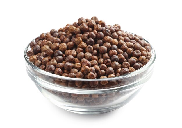 Grey peas in a glass bowl on a white background