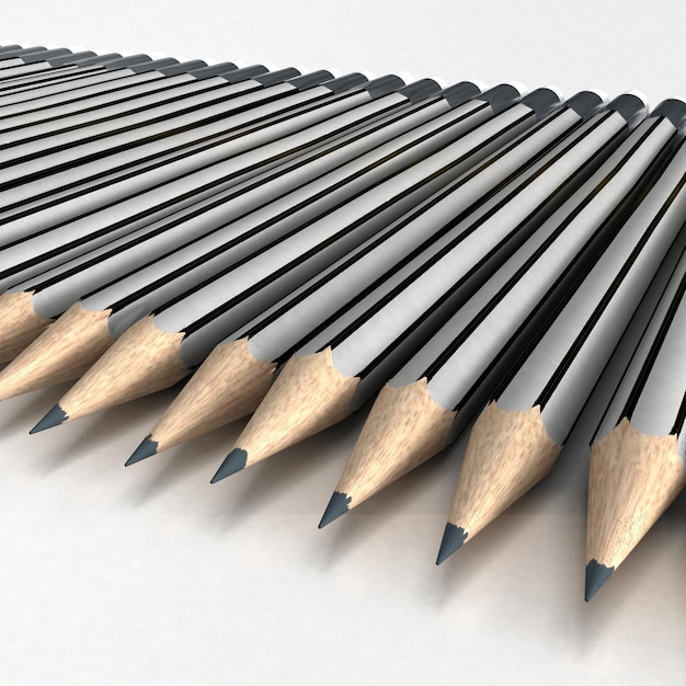 Grey pencils neatly arranged in a white surface