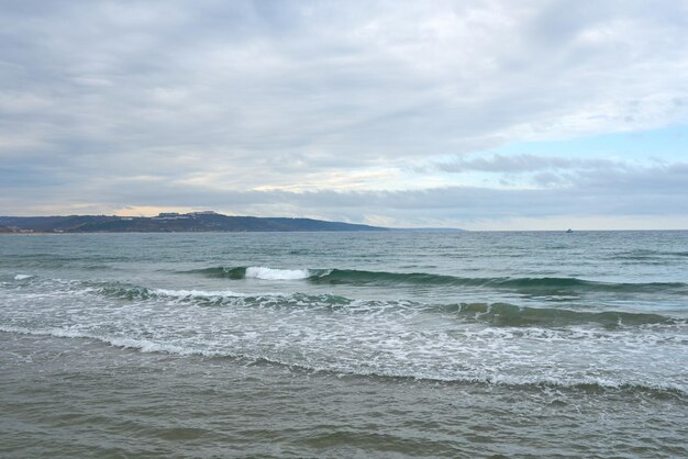 Grey sea and clouds in a cold day.