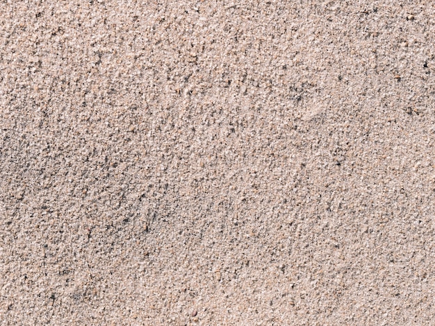 Grey textured sand on the beach