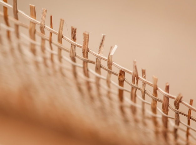 Grid of wooden rods on a blurred background, macro