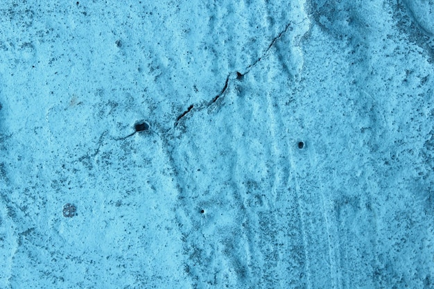 Grijsachtig groene stenen textuur van een oude vuile muur Vintage blauwe achtergrond Imperfect vlak van blauw gekleurd Siersteenachtig oppervlak