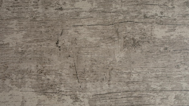 Grijze houten achtergrond van verweerd, verontrust rustiek hout met vervaagde witte verf met houtnerf