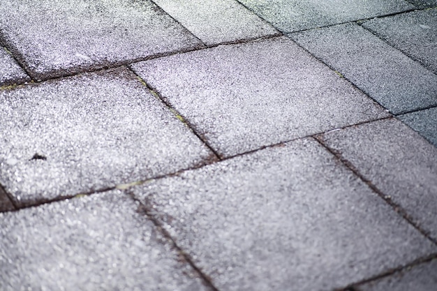 Grijze straatsteen, voetgangerspad, bestrating close-up, de textuur, bovenaanzicht. cement baksteen vierkante stenen vloer achtergrond. betonnen straatstenen. bestrating platen