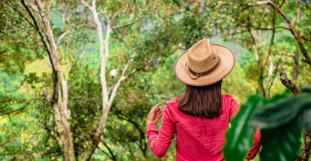 gril with hat in the forest