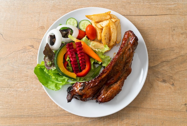 grill barbecue pork spare ribs with vegetables