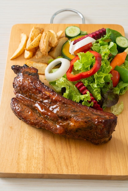 grill barbecue pork spare ribs with vegetables