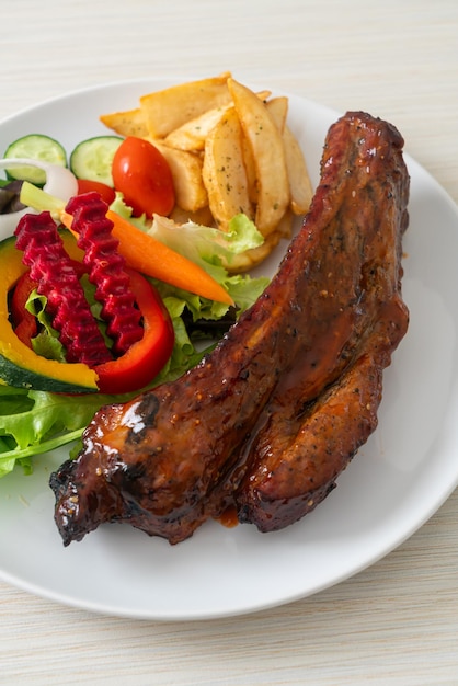 grill barbecue pork spare ribs with vegetables