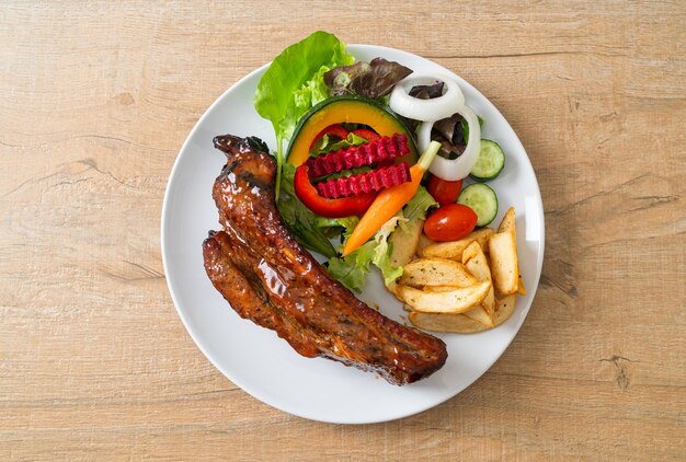 grill barbecue pork spare ribs with vegetables