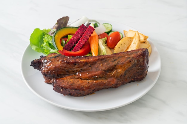 grill barbecue pork spare ribs with vegetables