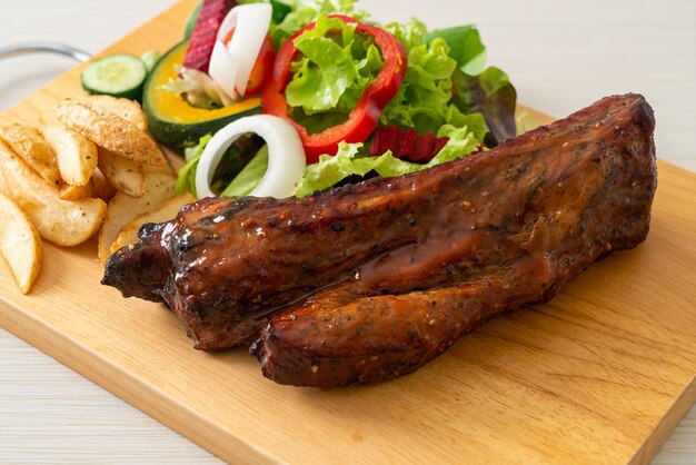 grill barbecue pork spare ribs with vegetables