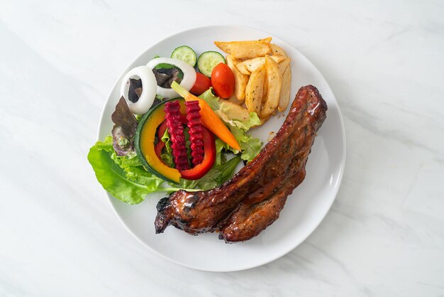 grill barbecue pork spare ribs with vegetables