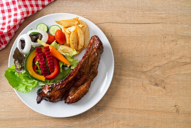 grill barbecue pork spare ribs with vegetables