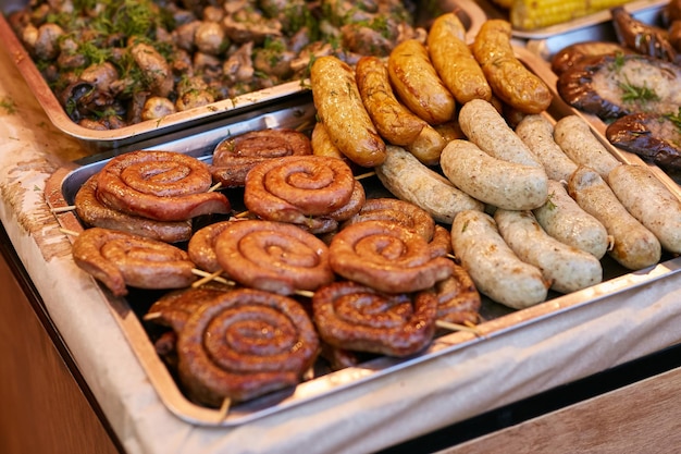 Grill sausages barbecue fried bacon on grilled yellow and red pepper grilled