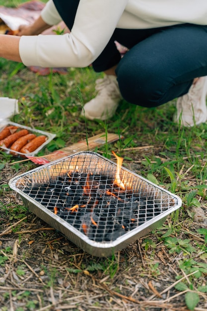 A grill with a grill on it that has the word hotdog on it.