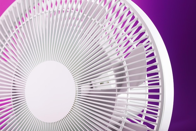 The grille and blades of the electric fan are white on a pink background.