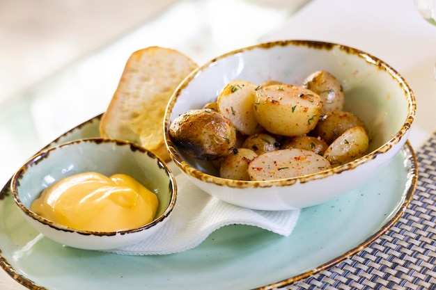 Grilled baby potatoes with toast and dip sauce