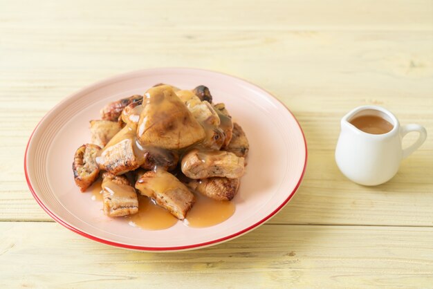 grilled bananas with coconut caramel sauce on plate