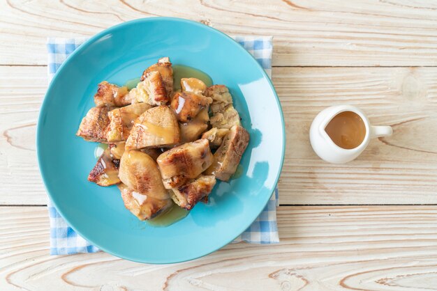 grilled bananas with coconut caramel sauce on plate