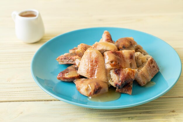 grilled bananas with coconut caramel sauce on plate