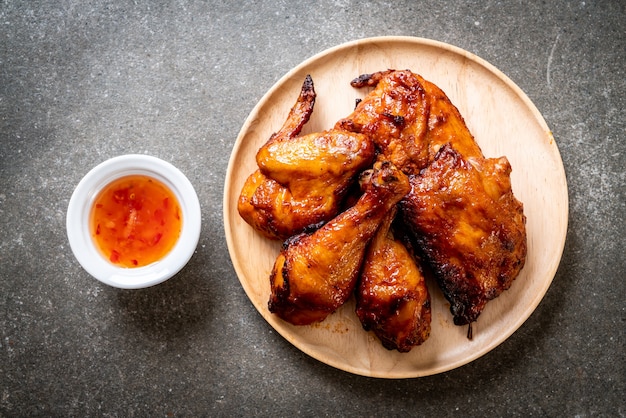 grilled and barbecue chicken on table